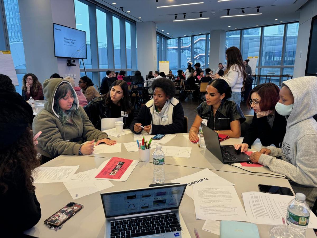 Students gathered around a table at Career Discovery Week at Tapestry HQ